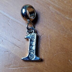 NWOT charm, silver colored number 1 with clear stone embellishments
